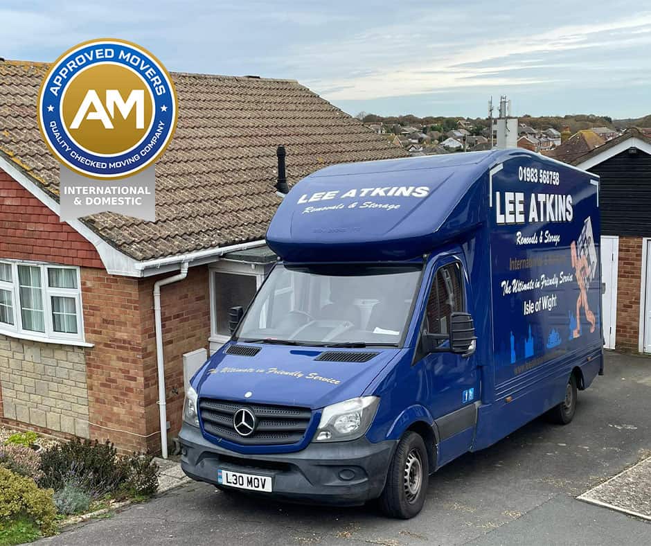 Stationary Lee Atkins removals lorry outside an Isle of Wight property